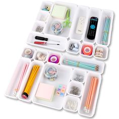 two trays filled with different types of stationery and office supplies on top of each other