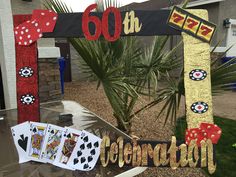 a table topped with cards next to a palm tree