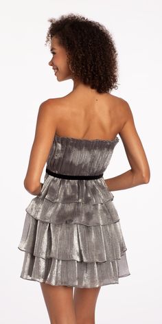 Celebrate your special day in style wearing our Strapless Organza Tiered Fit and Flare Dress. Ideal for cocktails, homecoming, wedding, holiday party or your recent RSVP! Our fit and flare silhouette flatters a range of body types, just view the details: a pleated strapless bodice with velvet waist accent, tiered organza skirt and open back. Complete this playful look with Rhinestone Satin Full Flap Handbag, Grand Fan CZ Drop Earrings, and High Heel Glitter Ankle Strap Sandals. Strapless Party Mini Dress With Pleated Bodice, Strapless Mini Dress With Pleated Bodice For Party, Glamorous Fit And Flare Mini Dress For Evening, Flirty A-line Strapless Dress For Party, Fit And Flare Strapless Dress For Party, Flirty Strapless Dress With Pleated Bodice For Party, Chic Holiday Evening Strapless Dress, Flirty Mini Dress With Pleated Bodice For Evening, Chic Holiday Strapless Dress For Cocktail