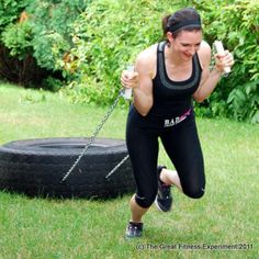 a woman is doing exercises in the yard