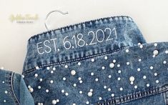 a pair of jeans that have been sewn with the date est161902 on them