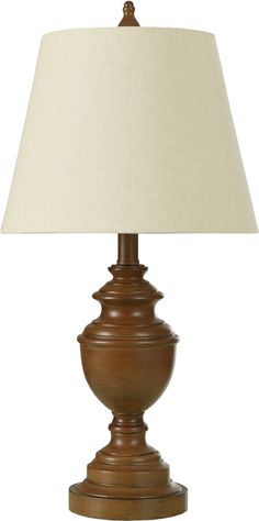 a wooden lamp with a white shade on it's base and a light bulb in the middle