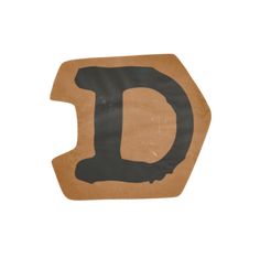 the letter d is made out of cardboard and has black paint on it's edges