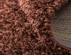 a close up view of a brown rug