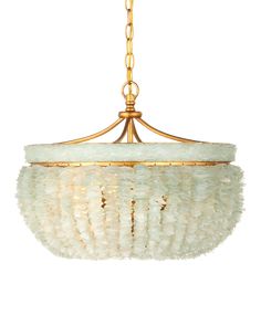 a chandelier hanging from the ceiling with white glass and gold trimmings