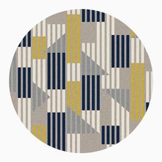 a circular rug with geometric shapes in grey, yellow and blue