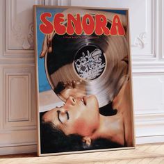 an old record with the word segora printed on it next to a wooden floor