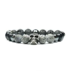 The icon of our skull bracelet is the GIANT - skull bracelet. The heavy bracelets are available in 5 different color combinations and add a rocky touch to any look. Combine the skull bracelet as an elegant eyecatcher to your watch or make a fashion statement to enhance a rather simple outfit. A trendy fashion accessory on the wrist of style-conscious men to emphasize your uniqueness and give your outfit that certain something. Product info: - 10mm Jasper, Onyx, Hematite and Lava Beads - Skull made of durable and stainless steel - Weight: between 39-43 g (depending on size) This bracelet is available in different sizes:  - Small: 16 cm  - Medium: 17 cm - Large: 19 cm - XLarge: 21 cm ... and in the following variations: - mounted on silicone string (elastic)  - mounted on wire and with toggl Skull Bracelet Men, Punk Skull, Trendy Fashion Accessories, Lava Beads, Skull Bracelet, Simple Outfit, Bracelet Gemstone, Beaded Skull, Gemstone Beaded Bracelets