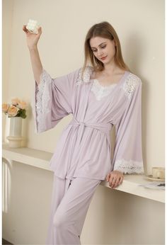 Experience ultimate comfort and elegance with our Sexy Modal Lace Backless Nightgown Robe Set, perfect for modern women who seek a blend of style and sensuality. Crafted from high-quality modal fabric, this three-piece set includes a backless camisole nightgown, long pants, and a matching robe. The soft, breathable fabric ensures a comfortable fit, while the intricate lace detailing adds a touch of luxury. Designed for spring, summer, and autumn wear, this versatile set is ideal for lounging at home or preparing for a romantic evening. Available in timeless black, creamy yellow, floral gray, and delicate lavender, this set is a must-have addition to any woman’s wardrobe. Key Features: High-Quality Modal Fabric: Made from premium modal, this nightgown robe set offers exceptional softness an Backless Nightgown, Linen Nightgown, Nightgown Long, Nightgown Robe, Pyjama Satin, Autumn Wear, Matching Robes, Silk Nightgown, Modal Fabric