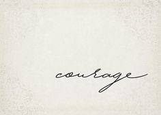 the word courage is written in cursive handwriting