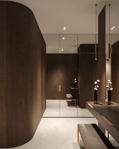 a modern bathroom with wooden walls and marble flooring, along with mirrors on the wall