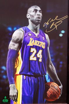 an autographed photograph of a basketball player with tattoos on his arm and shoulder