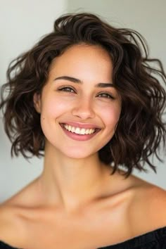 32 Stunning Short Curly Hairstyles You’ll Love - The Hairstyle Edit Choppy Bob Wavy Hair, Short Curly Hair Center Part, Short Curly Womens Hair, Curly Hairstyles Chin Length, Naturally Curly Bob Haircut, Mid Length Hair Wavy Natural, Medium Length Natural Hairstyles Curls, Curly Bob Hairstyles 2024, Short Thick Curly Haircuts