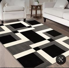 a black and white area rug in a living room