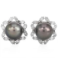 Opulent Estate South Sea Pearl Floral Diamond Earrings, masterfully crafted in 18K white gold. Featuring luxurious 16mm black South Sea pearls with a soft grey hue, these earrings are framed with an exquisite floral halo design of marquise diamonds, adding a dazzling touch of elegance. The 6.00 carats of natural marquise diamonds showcase mesmerizing brilliance, with H-I color and VS-SI clarity, making these earrings perfect for special occasions or upscale evening wear. The secure clip-on closu Marquise Diamond Earrings, Halo Diamond Earrings, Floral Halo, Jewelry Appraisal, Halo Earrings, Gold Statement Earrings, Sea Pearl, South Seas, South Sea Pearls