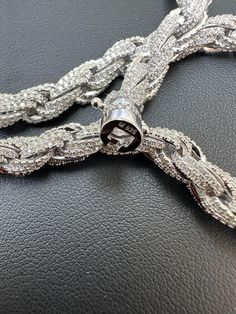 Men's 7.5mm wide iced rope chain set with moissanite stones
Amazing thing about rope chains is that they have stones on all sides! FULLY 3D - Unlike cubans that can flip and have a plain side...ropes have stones on ALL sides so cant flip!
 
Great necklace to wear with a pendant or by itself!
 
 
REAL VVS D Color MOISSANITE
Comes with GRA Certificate
PASSES DIAMOND TESTER!!! ANY PEN OR LIGHT TRANSMISSION DIAMOND TESTER (Will show up as moissanite and not dia Luxury Men's Silver Chain Jewelry, Iced Out Chain Link Jewelry For Streetwear, Luxury Silver Rope Chain Necklace, Luxury Metal Chain Necklace For Men, 10k Gold Chain, Red Stone Ring, Mens Silver Chain Necklace Jewelry1000.com, Diamond Tester, Rope Chain Necklace