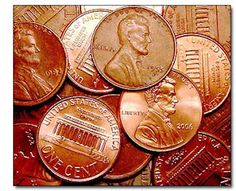 a pile of different types of coins sitting on top of each other