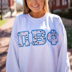 This trendy & unique Blue & Orange Leopard Gildan Greek Letter Crewneck Sweatshirt is sure to stand out on any campus! Grab one for you, your big/little, or a group of sisters Picture Details ⭑ #1-3: White sweatshirt, Light Blue background fabric (Pi Beta Phi) Care Instructions ⭑ Wash inside out on cold & air dry for best results ⭑ Do not dry clean ⭑ Light iron if necessary ⭑ Care instructions are included with every order. We are not responsible for damages if not cared for properly. Sweatshirt Sorority Crewneck, Big Little Basket, Sister Pictures, Letter Sweatshirt, Pi Beta Phi, Background Fabric, Light Blue Background, Greek Letters, Glitter Fabric