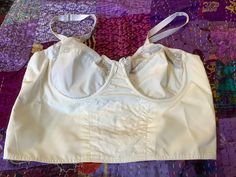 Bra In white crisp nylon taffeta Wired cups sized 95 European vintage sizing Adjustable straps  Column 9 hooks and two rows of row of eyes Cups have one wire running through Vintage sizing is different to modern, so check measurements against well fitting bra Cup 8 inches 20 cm across Vertically 7 inches 17.5 cm Underband 32/34 inches 81/86 below bust Lowest part 30 inches 76 cm Immaculate Elastic still snappy  No odours White Fitted Nylon Bra, Fitted White Nylon Bra, White Nylon Bra, White Nylon Underwire Bra, White Underwire Nylon Bra, White Wedding Bra With Adjustable Straps, Wedding Bra With Removable Cups, Fitted Nylon Bra With Removable Cups, White Fitted Bra With Adjustable Straps