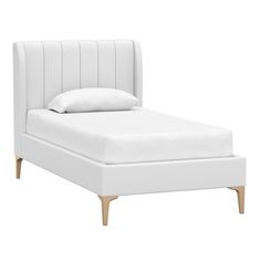 a bed with white linens and wooden legs on the headboard, against a white background