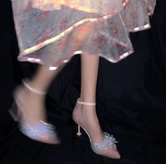 a woman's legs in high heels and a dress with sequins on it