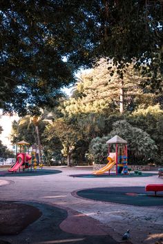 an empty playground in the middle of a park