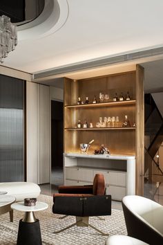 a living room filled with furniture and a chandelier