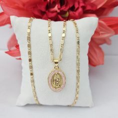 Gold Plated Virgen Of Guadalupe Pendant With Pink Quartz Measures 1 Inch. Includes A 22 Inches Long Chain, Lobster Clasp. Top Quality, Lasts Long And Wont Change Color Or Tarnish. Oro Laminado Medalla Religiosa De La Virgen De Guadalupe Con Quarzo Rosado. Mide 1 Pulgada E Incluye Cadena De 22 Pulgadas Tags: Religious Jewelry, Gift, Birthday, Anniversary, Mothers Day Quince Gifts Ideas, Quince Jewelry Gold, Quince Necklace Gold, Quince Necklace, Pink And Gold Quince, Virgen Of Guadalupe, Quince Gifts, Latina Jewelry, Quinceanera Jewelry