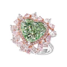 a fancy ring with green and pink stones in the shape of a heart, on a white background