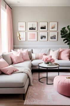 a living room filled with lots of furniture and pink pillows on top of it's walls