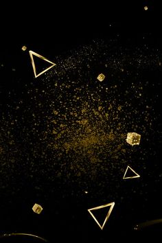 some gold triangles on a black background with white squares and glitters in the middle