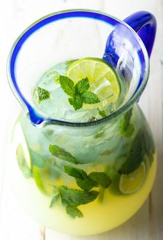 a pitcher filled with lemonade and mint garnish