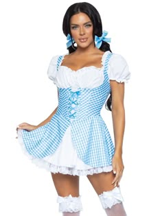 a woman in a blue and white costume posing for the camera with her hands on her hips