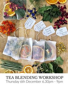 tea blending workshop with oranges, herbs and other items on a wooden table