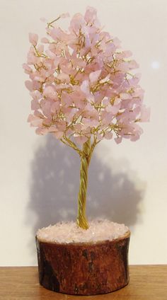 This is a handmade Rose Quartz Gem Tree. The gems have all been drilled through the center and in this case a gold color wire is through the hole so they are permanent and will not fall off. It contains a generous 300 gemstones. All of the branches can be moved so you can space them where it works best for your use. They can be spaced out to use as an earring holder. It will be approximately 9 - 10" tall . These are generic pictures. Earring Holder, Flea Market, Rose Quartz, Embellishments, Gold Color, Beauty Book, Gems, Display Homes, Gemstones