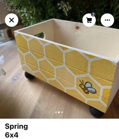 a wooden box with bees painted on it and the words, spring 6x4