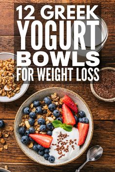 yogurt bowl with berries and granola in it on top of a wooden table