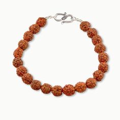 Simple elegance distinguishes our Rudraksha wrist mala made from activated Rudraksha Power Beads, in sterling silver. Known as "Bead of Self Mastery" Rudraksha encourages wise decision making as well as endurance and strength in our endeavors. It magnetizes greater opportunities to us and enhances our ability to fulfill our deepest intentions with strength from within. Activated Rudraksha 7mm Wrist Mala fits a wrist size 6.0" - 7.5" Sterling Silver Ornate S Clasp Made with devotion by traditiona Spiritual Hand Knotted Bracelets With Round Beads, Spiritual Sterling Silver Beaded Bracelets, Silver Mala With Round Beads For Meditation, Silver Spiritual Mala For Puja, Spiritual Silver Beads Mala Gift, Spiritual Silver Mala With 8mm Beads, Spiritual Sterling Silver Beaded Bracelets With Gemstone, Sterling Silver Spiritual Beaded Bracelets With Gemstones, Spiritual Silver Hand-strung Rosary Bracelet