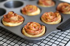 cupcakes in a muffin tin on a cooling rack