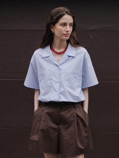 This is a trendy and feminine half shirt by THE RYE that is made out of high quality and sturdy material. With distinctive mood of the design and clean and refined look, you can style it for your modern and feminine daily outfit.- Feminine and comfortable mood- Soft touch of tencel and nylon blend fabric- Button and loop on the collar Short Sleeve Shirt With Striped Collar For Work, Casual Shirt With Vertical Stripes For Office, Collared Shirt With Vertical Stripes For Work, Modern Tops With Striped Collar For Work, Modern Top With Striped Collar For Work, Vertical Stripes Shirt For Office In Spring, Vertical Striped Shirt For Office In Spring, Vertical Stripes Shirt For Summer Workwear, Spring Office Shirt With Vertical Stripes