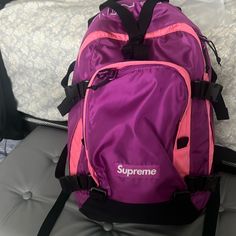 Pink Supreme Backpack W/Original Sale Rcpt And Tag From March 2024 Designer School Backpack, Designer School Bag With Adjustable Strap, Standard Backpack For Streetwear, Designer Rectangular Streetwear Bag, Designer Pink Backpack, Designer Purple Travel Bag, Functional Pink Bags For Streetwear, Rectangular Backpack With Adjustable Strap For Streetwear, Streetwear Backpack With Adjustable Straps