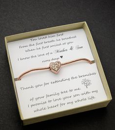 a heart bracelet in a box with a poem written on the front and back of it