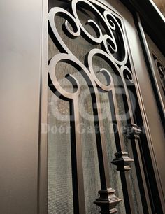 an iron door with decorative designs on it