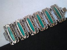 ON SALE Love the look and color of this very wide bracelet. It's one I could just keep. Has such a great Style. It is in very good vintage condition. And measures just over seven and a quarter inches long by 2 and a quarter inches wide. Handmade Retro Green Jewelry, Mid-century Green Collectible Jewelry, Retro Green Bracelet Jewelry, Green Retro Bracelet As A Gift, Retro Green Bracelets For Gifts, Retro Green Bracelet For Gift, Retro Green Bracelets For Gift, Green Art Deco Bracelets As A Gift, Retro Green Bracelet Gift