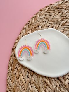 These lightweight Rainbow acrylic Dangles will add the perfect amount of color and whimsy to any outfit. Perfect for teachers, or just anyone who loves to stand out in a colorful and beautiful way.  Laser engraved right her in KS, hand painted and finished with our proprietary 14k PVD dipped non tarnishing stainless steel make these perfect for even sensitive skin. Introducing our Rainbow acrylic Dangles that will instantly brighten up any ensemble. Stand out in a colorful and beautiful way with our whimsical earrings that are sure to bring joy to your day. Playful Multicolor Personalized Earrings, Playful Personalized Multicolor Earrings, Hand Painted Multicolor Cute Earrings, St. Patricks Day, Rainbow Cloud, Saint Patrick, St Patricks, Laser Engraved, St Patricks Day