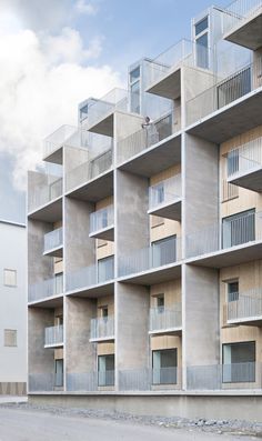 an apartment building with balconies on each floor