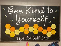 a sign that says bee kind to yourself tips for self care hangs on the wall