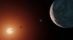 an artist's rendering of the planets in space, including one planet and two smaller ones