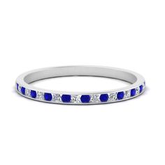 a white gold band with blue sapphire stones