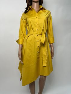 Shirt with a loose A silhouette and 3/4 sleeve with cuff in a pleasant and modern mustard color . There is a removable belt to accentuate the waist. A comfortable dress for leisure and the city. Light and pleasant cotton fabric. It can be combined with elegant shoes or sneakers. Fabric composition cotton, polyester and elastane. We also make the model in individual sizes. If you like, send your measurements and you will have a dress just for you. We choose the fabrics and patterns for our clothe Elegant Shirt Dress With 3/4 Sleeves And Buttons, Elegant 3/4 Sleeve Shirt Dress With Buttons, Cotton Long Sleeve Dress With Cuffed Sleeves, Summer Dresses With 3/4 Sleeves, Summer Dresses With 3/4 Roll-up Sleeves, Spring Office Dresses With Asymmetrical Hem, Knee-length Shirt Dress With Cuffed Sleeves For Spring, Spring Knee-length Shirt Dress With Cuffed Sleeves, Elegant Shirt Dress With 3/4 Sleeves For Fall